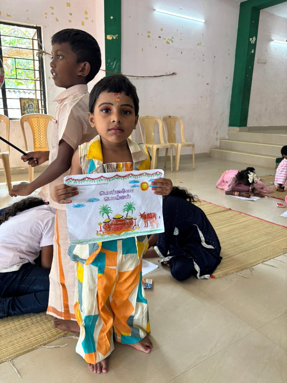 Children performing during Pongal